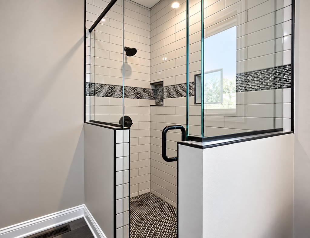 Custom tiled shower with glass enclosure