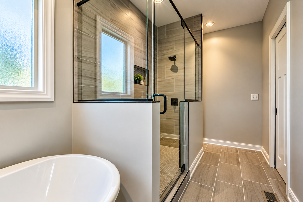 Custom tiled shower with glass enclosure
